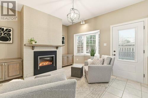 24 - 2407 Woodward Avenue, Burlington, ON - Indoor Photo Showing Living Room With Fireplace