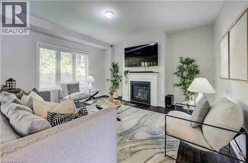 55 Tulip Crescent, Simcoe, ON - Indoor Photo Showing Living Room With Fireplace