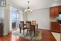 Patio doors lead to fenced backyard. - 