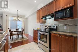 Tiled Kitchen overlooks Dining Rm. - 