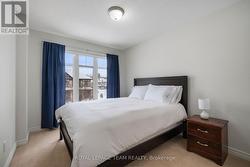 Bedroom with large windows. - 