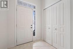 Spacious tiled Foyer with large closet. - 