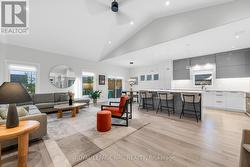 Perfectly appointed with a 12 ft vaulted ceiling. - 