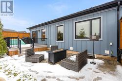 Composite deck and interlocking stone patio - 