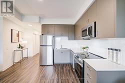 Sleek Upgraded Kitchen With Quartz - 