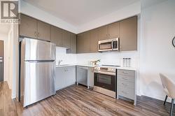 Sleek Upgraded Kitchen With Quartz - 