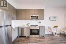 Sleek Upgraded Kitchen With Quartz - 