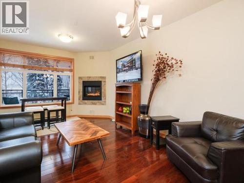 103-32 Waterfront Place, Whitehorse, YT - Indoor Photo Showing Living Room With Fireplace