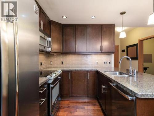 103-32 Waterfront Place, Whitehorse, YT - Indoor Photo Showing Kitchen With Stainless Steel Kitchen With Double Sink With Upgraded Kitchen