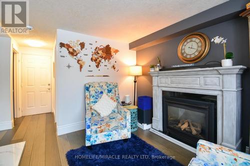 39 Endeavour Drive, Cambridge, ON - Indoor Photo Showing Living Room With Fireplace
