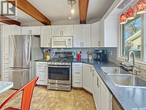 19 Marquis Crescent, Regina, SK - Indoor Photo Showing Kitchen With Double Sink