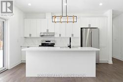 Kitchen with sit-up island - 