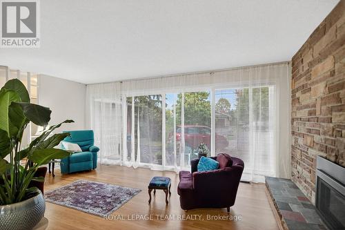 Natural light floods the home - 46 Quinpool Crescent, Ottawa, ON - Indoor Photo Showing Living Room With Fireplace