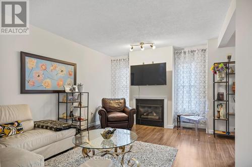 58 - 1199 Hamilton Road, London East (East P), ON - Indoor Photo Showing Living Room With Fireplace