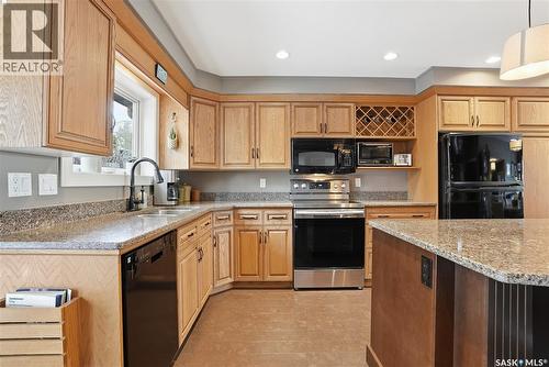250 Emerald Terrace, Saskatoon, SK - Indoor Photo Showing Kitchen With Double Sink