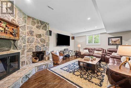 Recreation Room Features a Wood Burning Fireplace - 2315 8 Sideroad, Burlington, ON - Indoor Photo Showing Living Room With Fireplace
