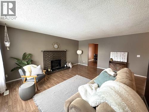 9016 98A Avenue, Fort St. John, BC - Indoor Photo Showing Living Room With Fireplace