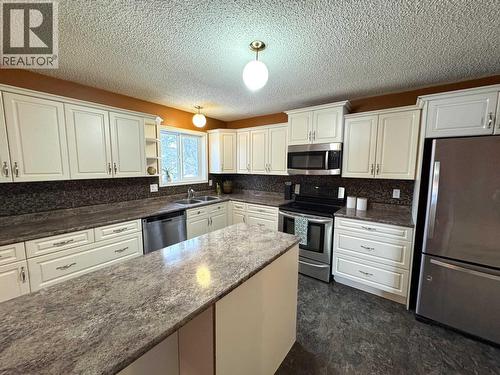 9016 98A Avenue, Fort St. John, BC - Indoor Photo Showing Kitchen With Double Sink