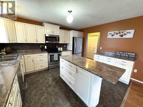 9016 98A Avenue, Fort St. John, BC - Indoor Photo Showing Kitchen With Double Sink