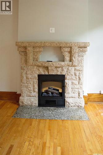 8 2201 14Th Avenue, Regina, SK - Indoor Photo Showing Living Room With Fireplace