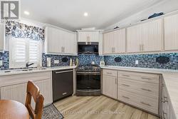 Kitchen with Black Stainless Steel Appliances - 