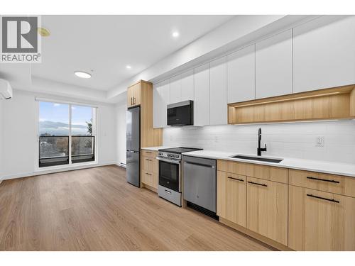 kitchen and living room - 1380 Pridham Avenue Unit# 505, Kelowna, BC - Indoor Photo Showing Kitchen With Upgraded Kitchen