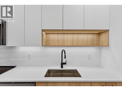 beautiful counters and wood work - 1380 Pridham Avenue Unit# 505, Kelowna, BC - Indoor Photo Showing Kitchen With Upgraded Kitchen