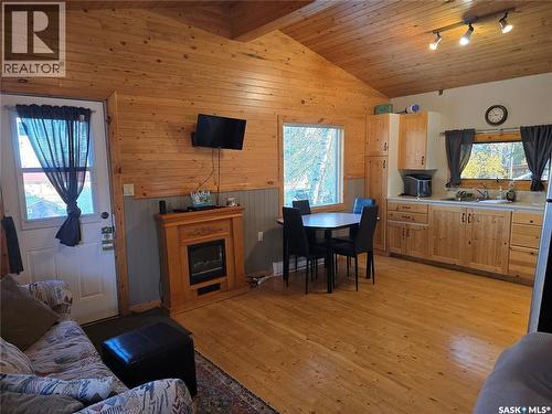 207 Pine Drive, Tobin Lake, SK - Indoor Photo Showing Other Room With Fireplace