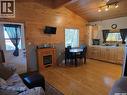 207 Pine Drive, Tobin Lake, SK  - Indoor Photo Showing Other Room With Fireplace 