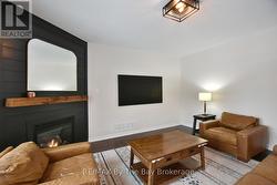 Living Area with Gas Fireplace on a Feature Wall - 