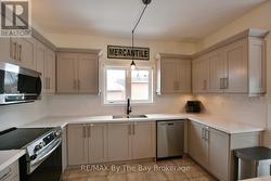 Open Concept Kitchen with Stainless Appliances - 