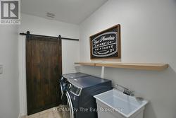 Main Floor Laundry Room with Garage Access - 