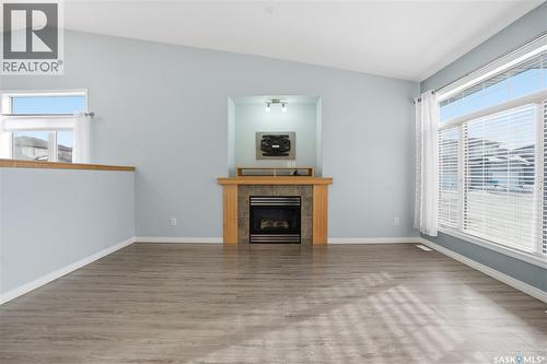 7902 Thrush Street, Regina, SK - Indoor Photo Showing Living Room With Fireplace
