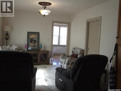 115 1St Street E, Leader, SK - Indoor Photo Showing Living Room With Fireplace