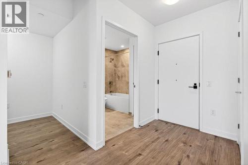 Entryway featuring wood-finish flooring, white walls, and a recessed ceiling light - 500 Plains Road E Unit# 207, Burlington, ON - Indoor Photo Showing Other Room