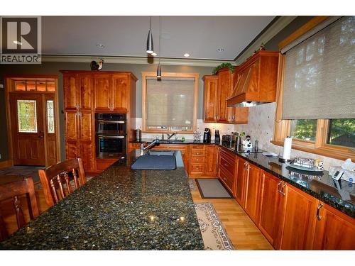 Lots of soft-close cabinets and gorgeous countertops with built in stainless steel appliances. - 19-3453 Cessna Road, Enderby, BC - Indoor Photo Showing Kitchen