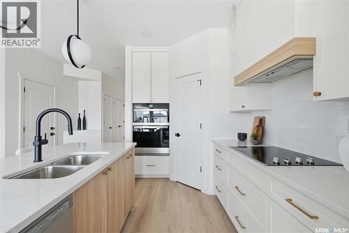 24 720 Brighton Boulevard, Saskatoon, SK - Indoor Photo Showing Kitchen With Double Sink
