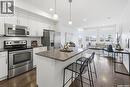 212 770 Childers Crescent, Saskatoon, SK  - Indoor Photo Showing Kitchen With Stainless Steel Kitchen With Upgraded Kitchen 