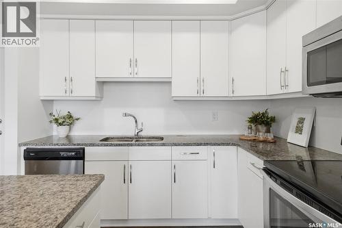 212 770 Childers Crescent, Saskatoon, SK - Indoor Photo Showing Kitchen With Double Sink