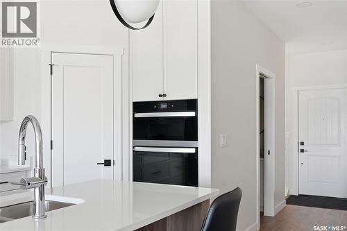 22 720 Brighton Boulevard, Saskatoon, SK - Indoor Photo Showing Kitchen With Double Sink