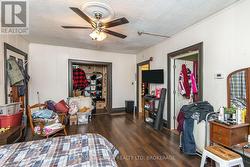 MAIN FLOOR LIVINGROOM, CURRENTLY USED AS A BEDROOM - 