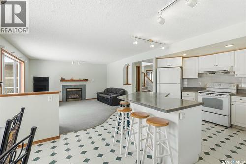 3232 Thames Crescent E, Regina, SK - Indoor Photo Showing Kitchen With Fireplace