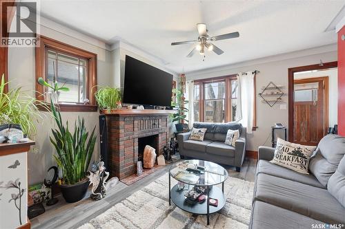 1306 C Avenue N, Saskatoon, SK - Indoor Photo Showing Living Room With Fireplace