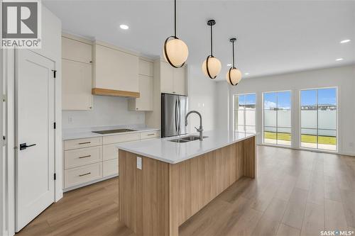 4 720 Brighton Boulevard, Saskatoon, SK - Indoor Photo Showing Kitchen With Double Sink With Upgraded Kitchen
