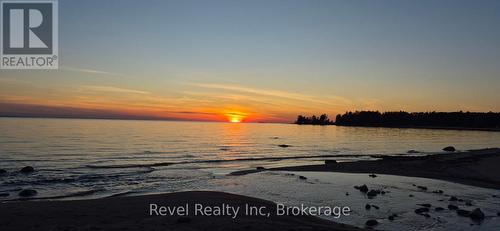 mesmerizing sunsets on the beach - 12 Walker Road, Tiny, ON - Outdoor With Body Of Water With View