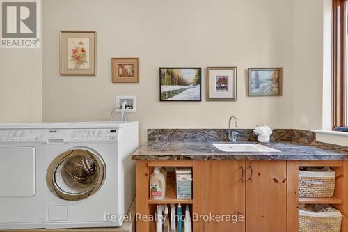 main floor laundry - 12 Walker Road, Tiny, ON - Indoor Photo Showing Laundry Room