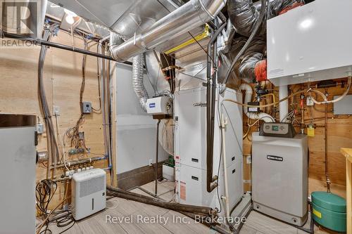 geothermal cooling and heating w gas water furnace - 12 Walker Road, Tiny, ON - Indoor Photo Showing Basement