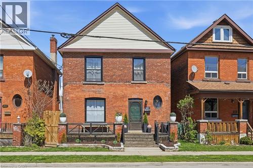 Brick exterior with a peaked gable and horizontal siding - 361 Cumberland Avenue, Hamilton, ON - Outdoor With Deck Patio Veranda With Exterior