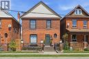 Brick exterior with a peaked gable and horizontal siding - 361 Cumberland Avenue, Hamilton, ON  - Outdoor With Deck Patio Veranda With Exterior 