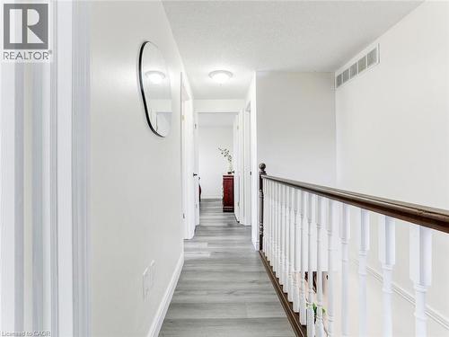 Hallway featuring wood-finish flooring, white walls, and recessed lighting - 154 Deerpath Drive, Guelph, ON - Indoor Photo Showing Other Room